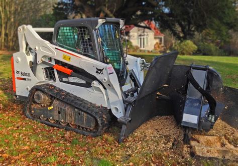 bobcat skid steer tree cutter|bobcat with rotary grinder.